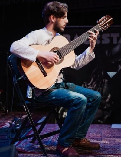 Renzo Navone Rodriguez teaches guitar at the music school in Rotterdam.
